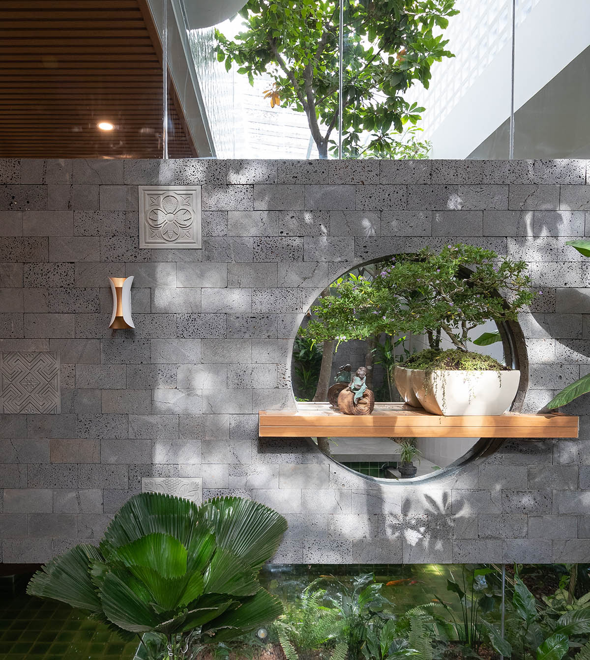 CoCo House, inspired by animated film, is clad in glass brick façade with wavy patterns in Vietnam