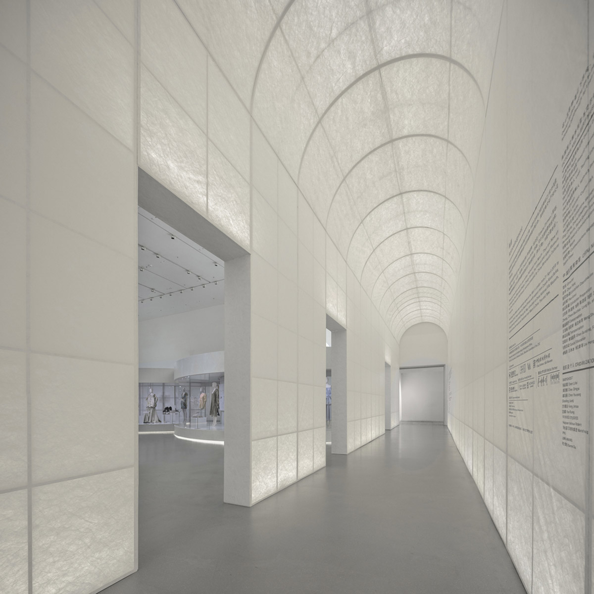 Studio 10 designs exhibition space with white tubular structures and black translucent ramps in China
