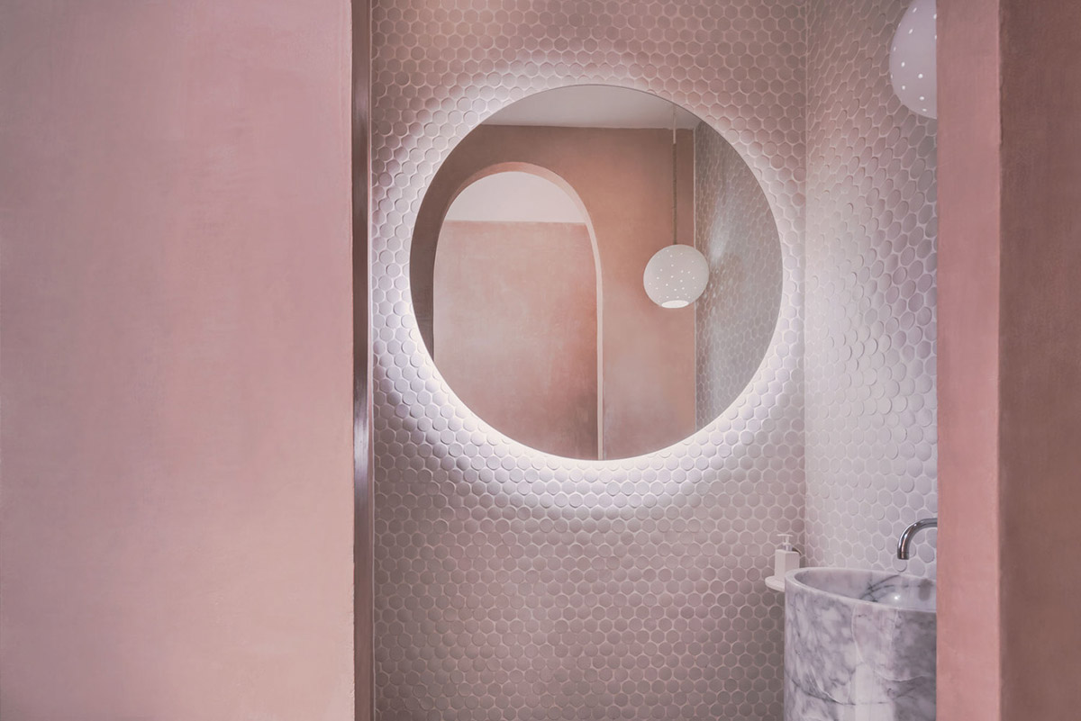 onion combines white concave and convex walls with colorful surfaces for beach resort in Thailand