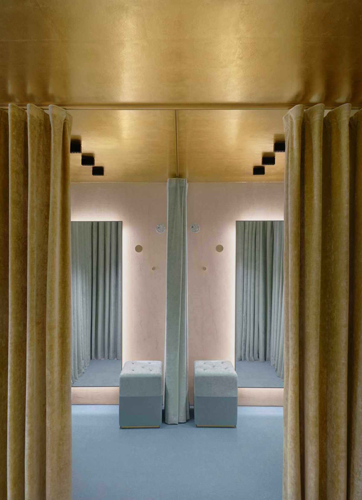 Golden and powder-colored details dominate forte_forte forte dei Marmi boutique in Italy