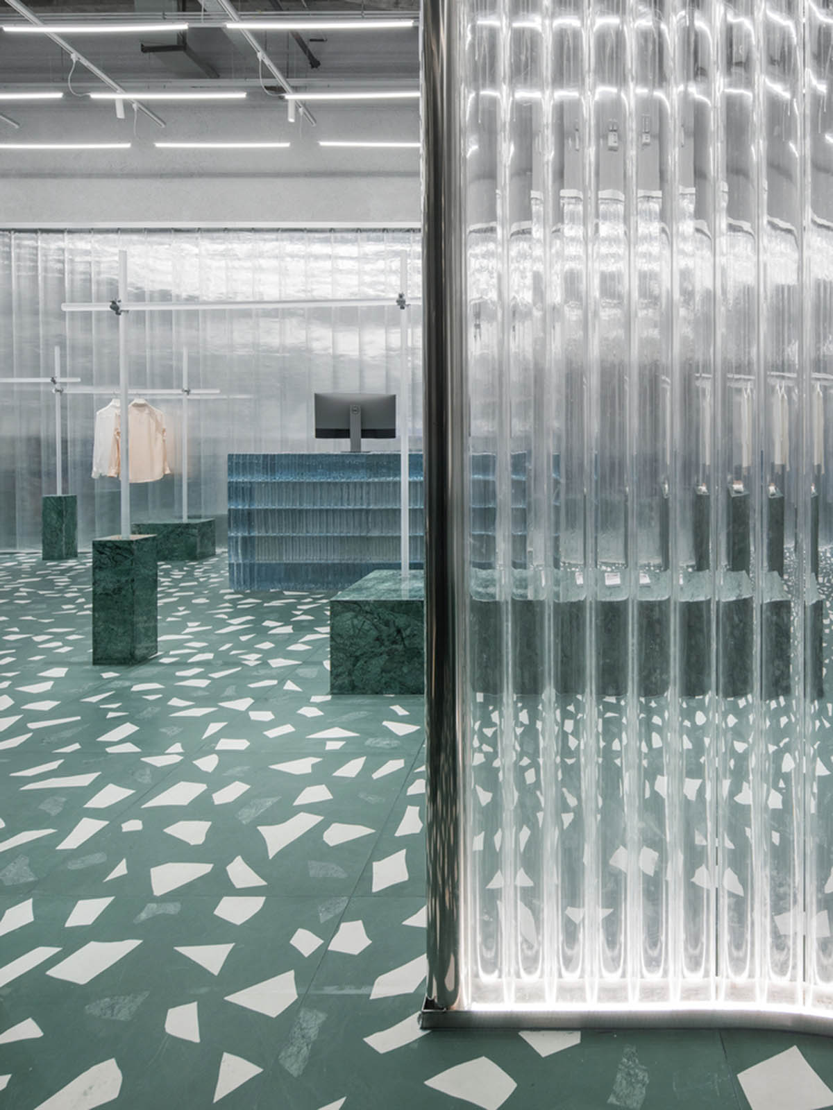 Studio 10 designs fashion store combining different hues of green color ...
