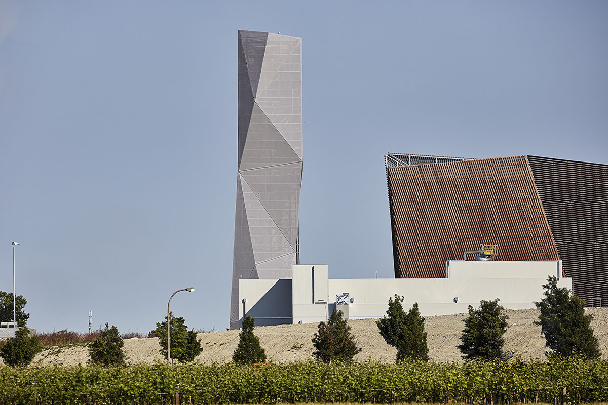 Large triangular surfaces camouflage this bioenergy power plant designed by Giovanni Vaccarini