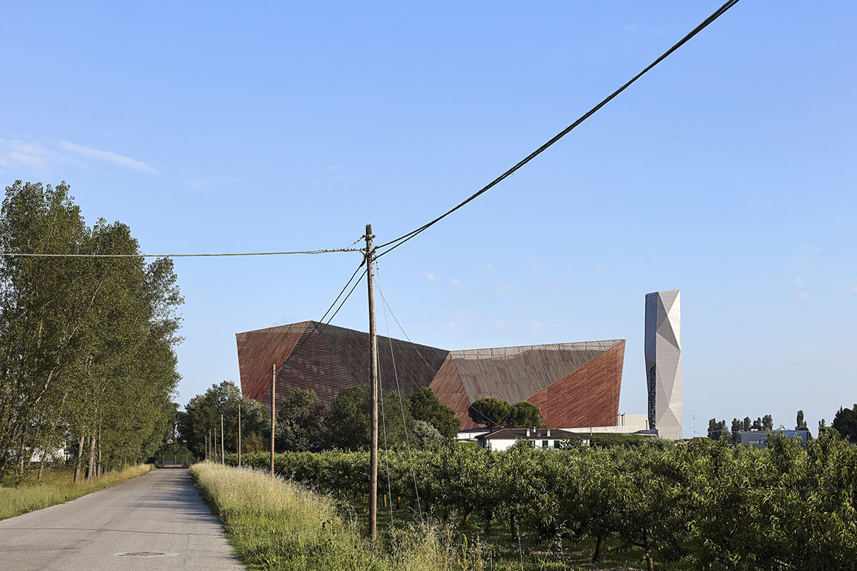 Large triangular surfaces camouflage this bioenergy power plant designed by Giovanni Vaccarini