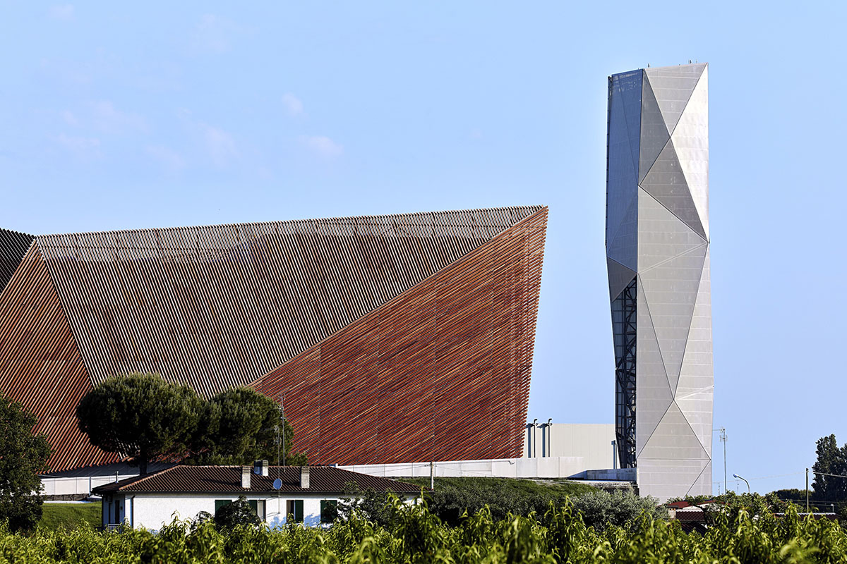 Large triangular surfaces camouflage this bioenergy power plant designed by Giovanni Vaccarini