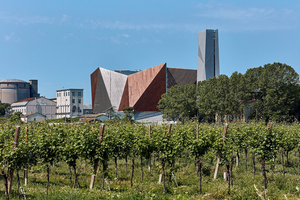Large triangular surfaces camouflage this bioenergy power plant designed by Giovanni Vaccarini