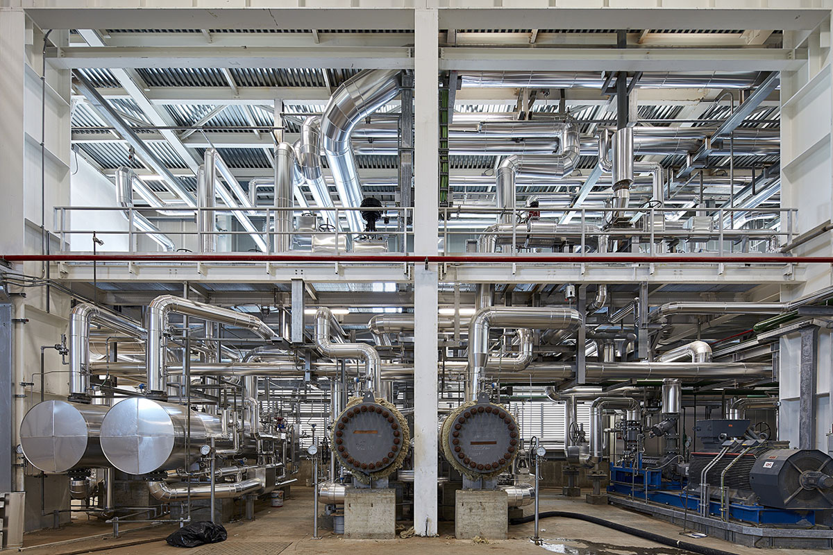 Large triangular surfaces camouflage this bioenergy power plant designed by Giovanni Vaccarini