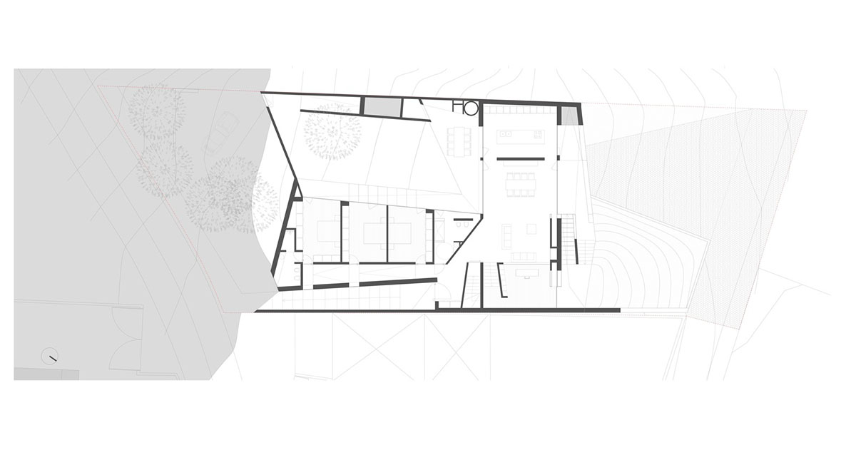 Contaminar Arquitectos built cave-like house from irregular walls inspired by rocky topography