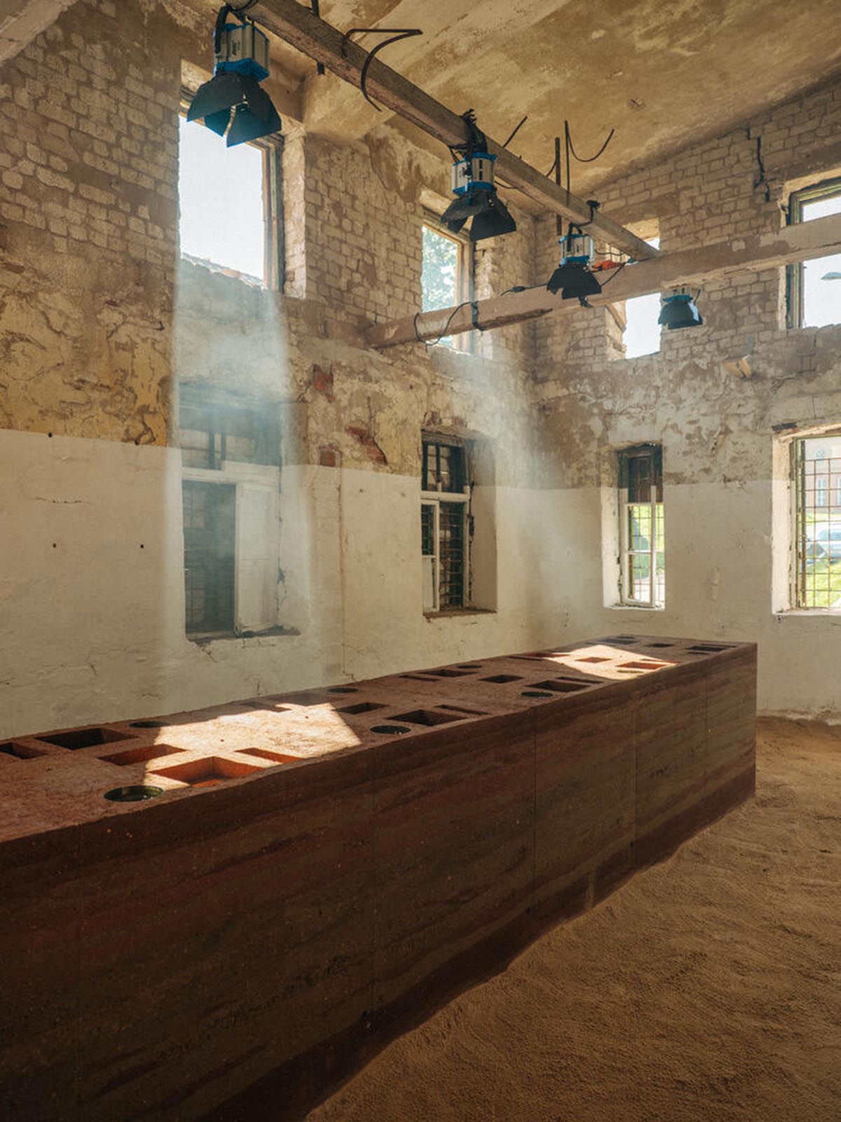 studio Kuidas.works creates zero-waste restaurant in Estonia with a 15-ton rammed-earth table