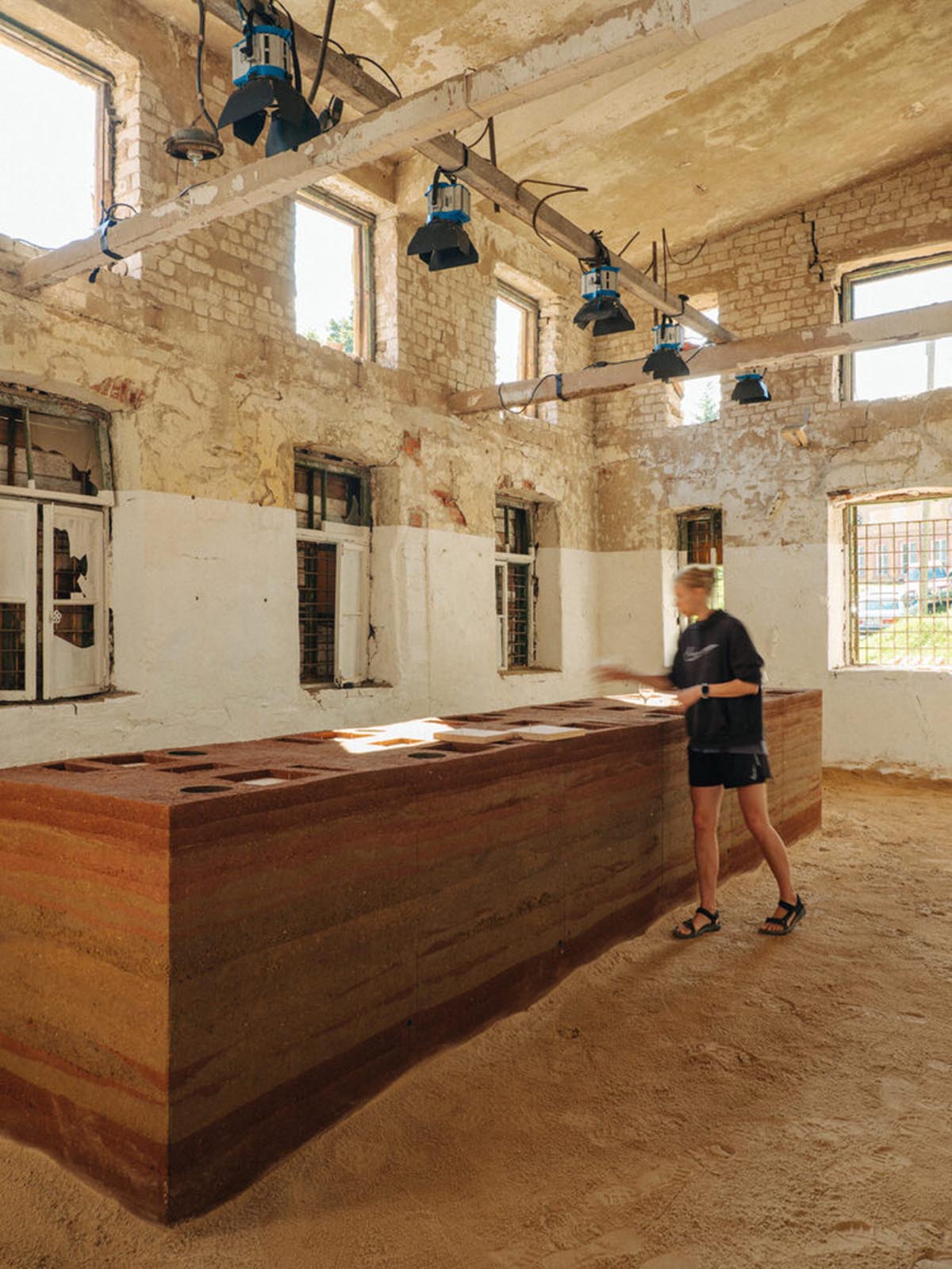 studio Kuidas.works creates zero-waste restaurant in Estonia with a 15-ton rammed-earth table