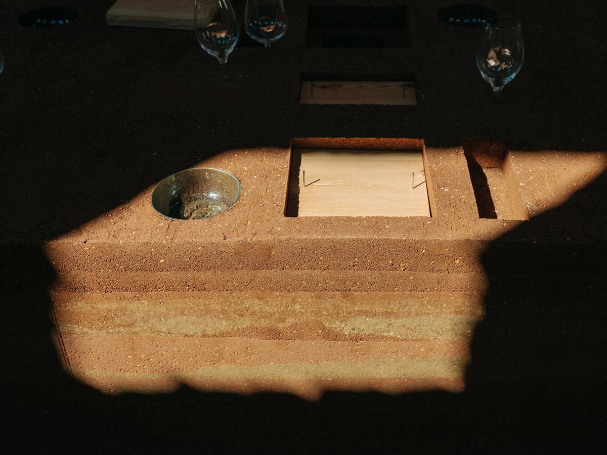 studio Kuidas.works creates zero-waste restaurant in Estonia with a 15-ton rammed-earth table