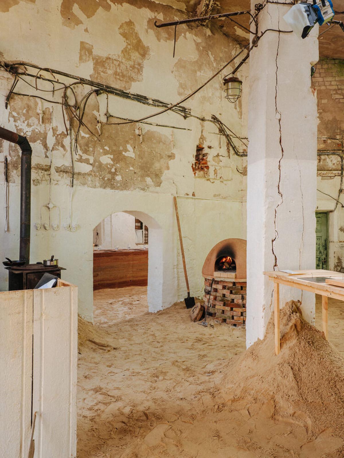 studio Kuidas.works creates zero-waste restaurant in Estonia with a 15-ton rammed-earth table