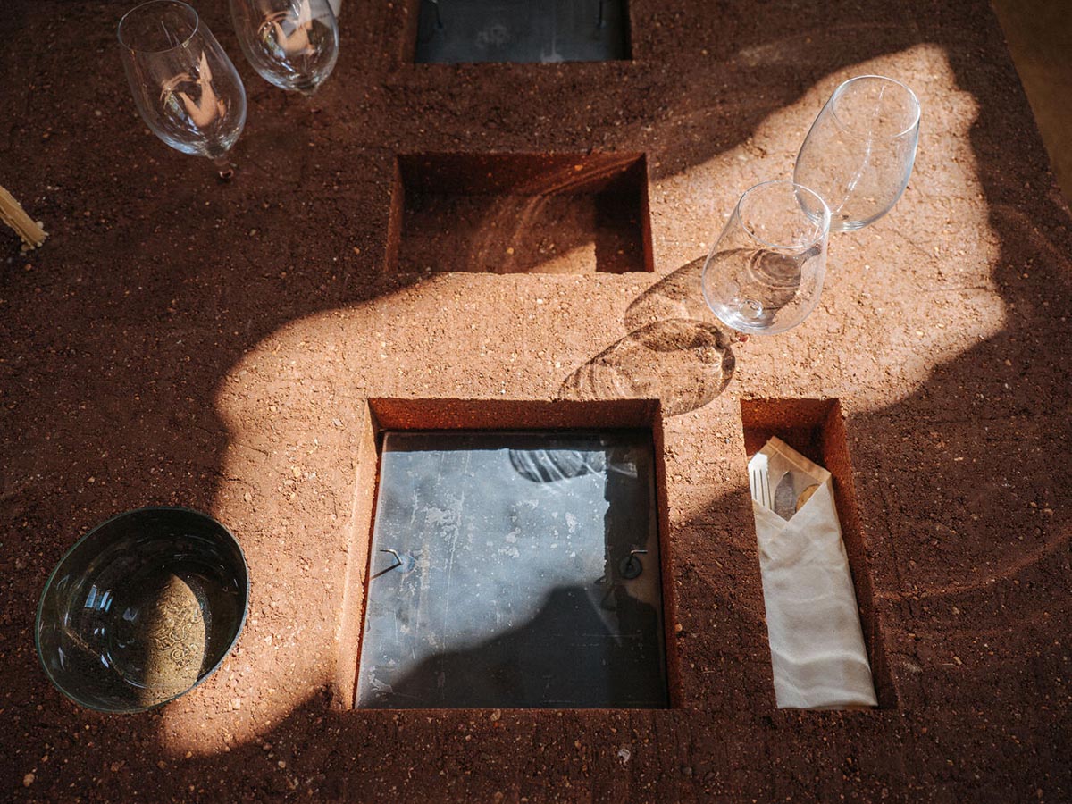 studio Kuidas.works creates zero-waste restaurant in Estonia with a 15-ton rammed-earth table