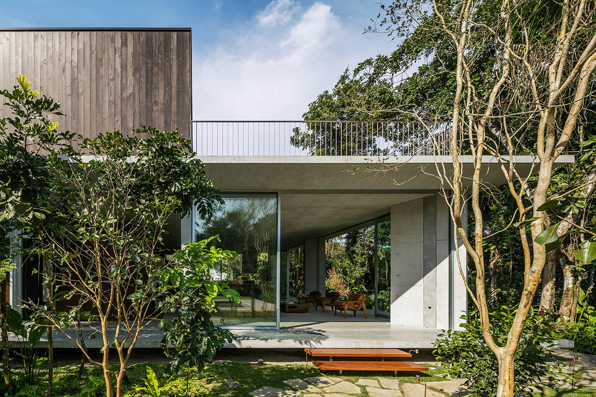 Gui Mattos created open plan for this concrete house to become a part of dense rainforest in Brazil