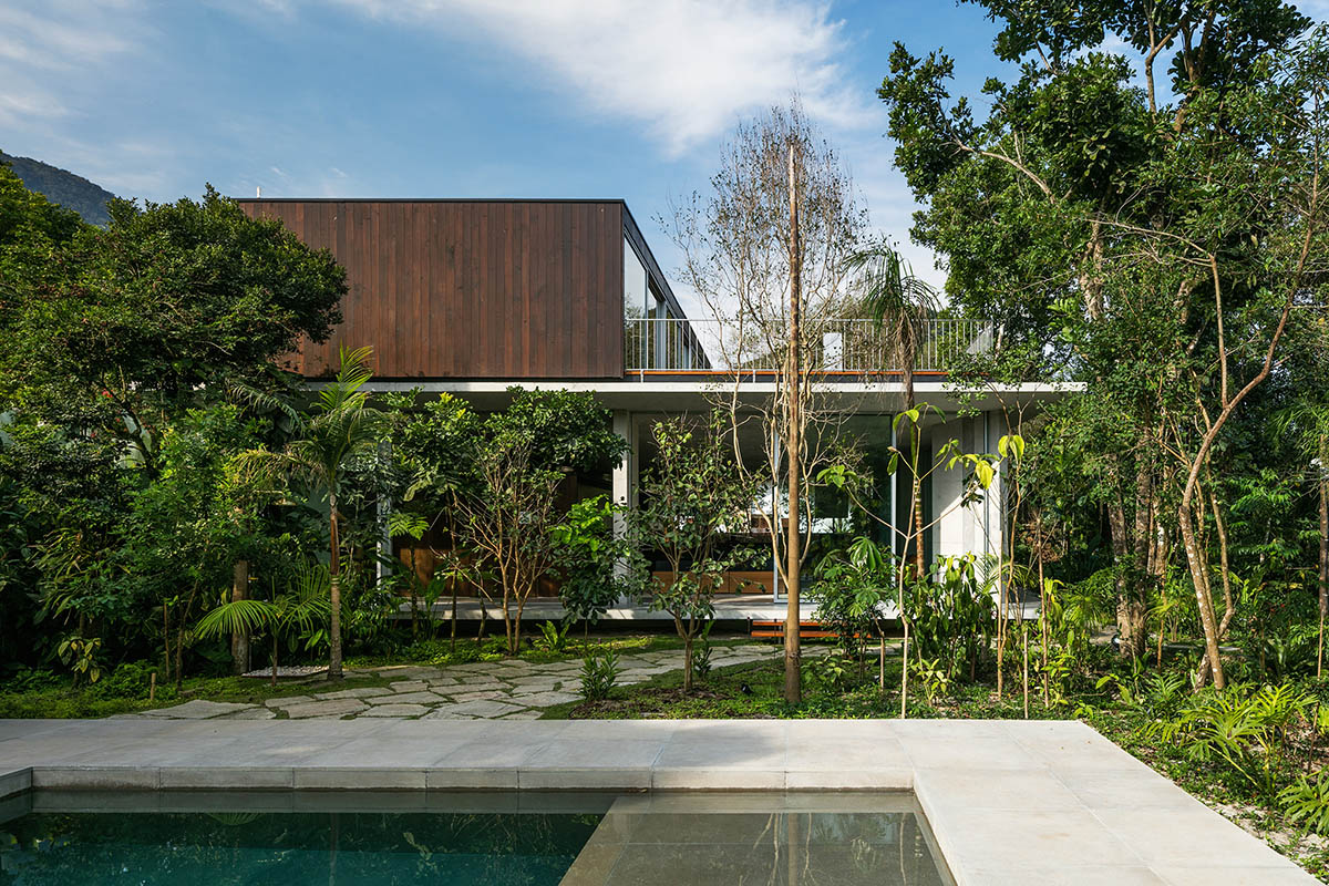 Gui Mattos created open plan for this concrete house to become a part of dense rainforest in Brazil