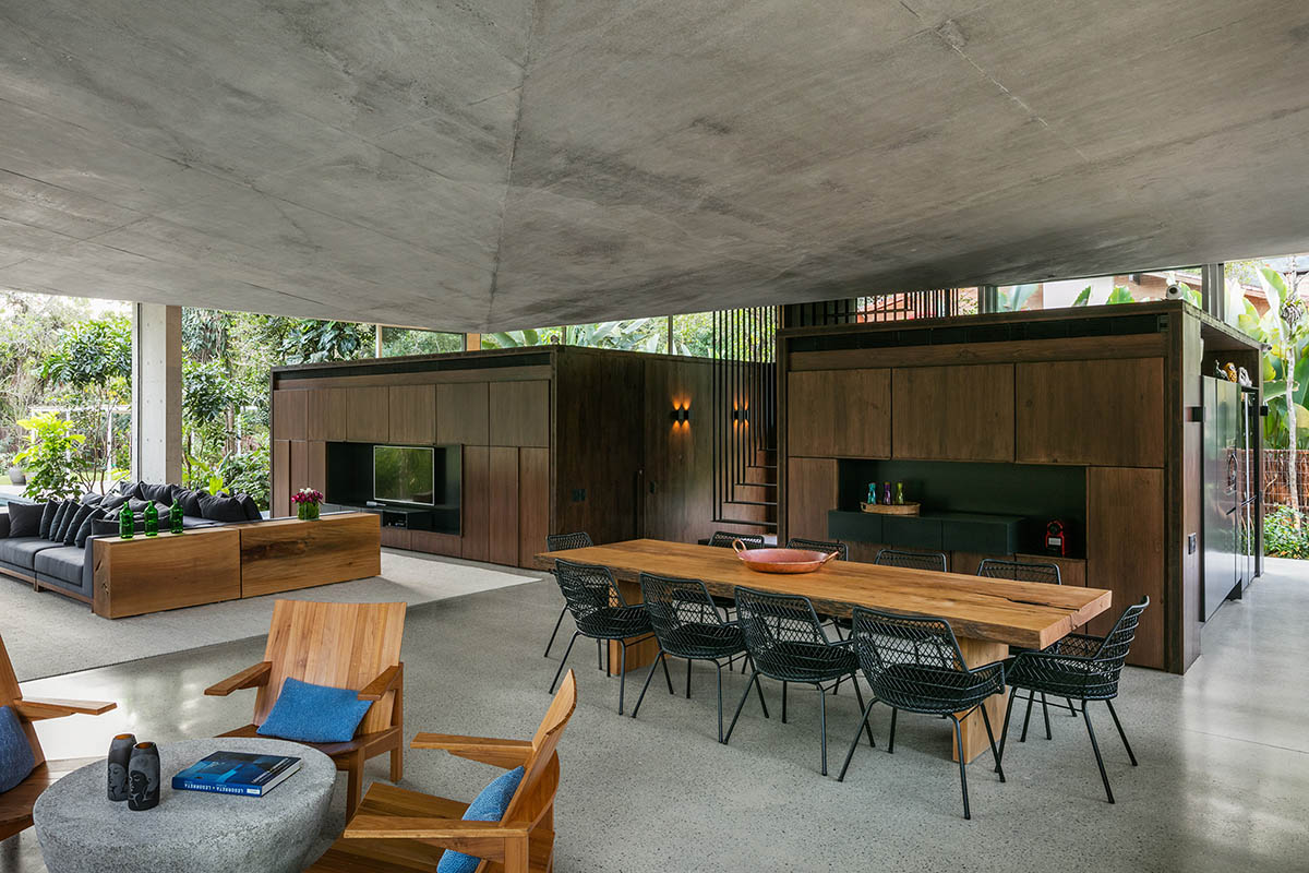 Gui Mattos created open plan for this concrete house to become a part of dense rainforest in Brazil