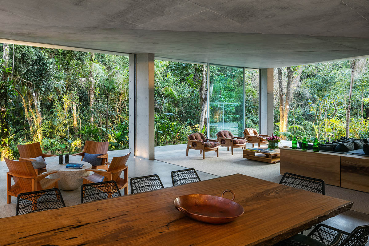 Gui Mattos created open plan for this concrete house to become a part of dense rainforest in Brazil