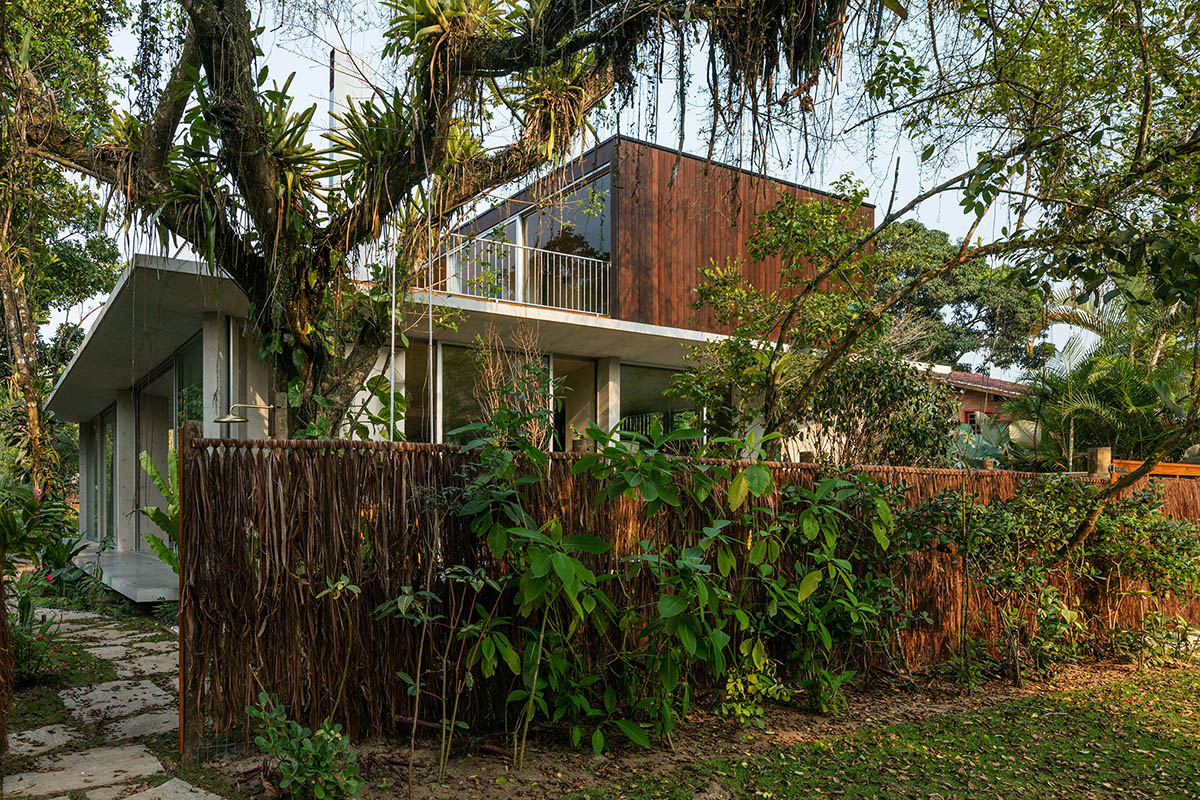 Gui Mattos created open plan for this concrete house to become a part of dense rainforest in Brazil