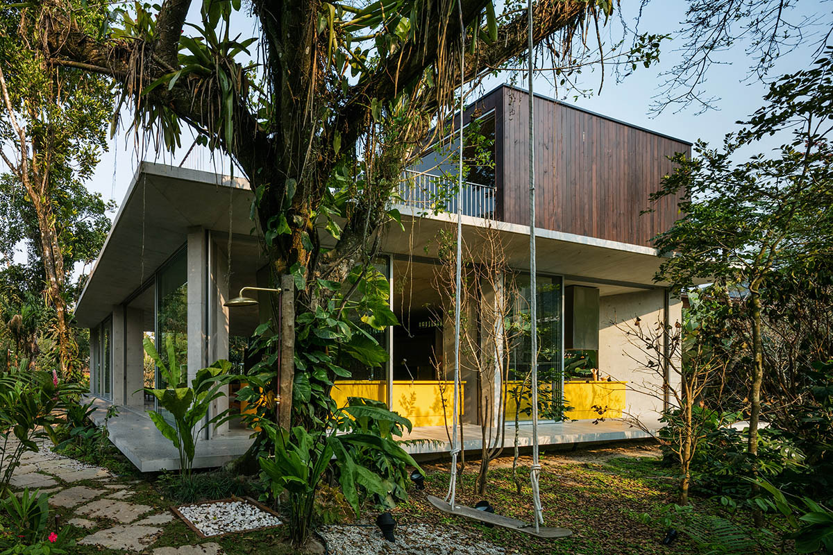 Gui Mattos created open plan for this concrete house to become a part of dense rainforest in Brazil