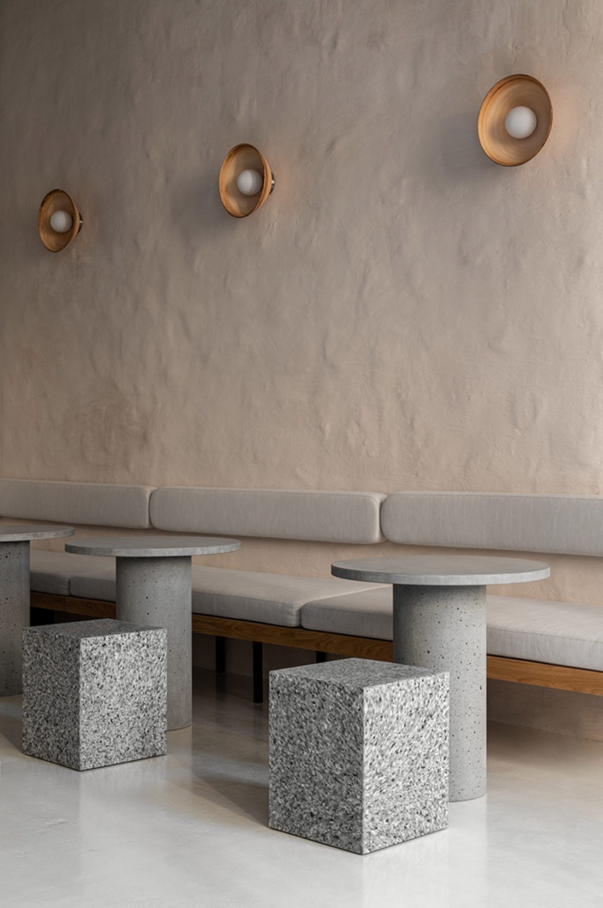 Earth-toned materials and soft lines form interiors of this ready-to-eat food restaurant in Kyiv