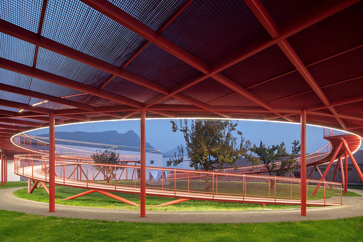 REDe Architects and Moguang Studio add red circular platform to renovated youth activity center