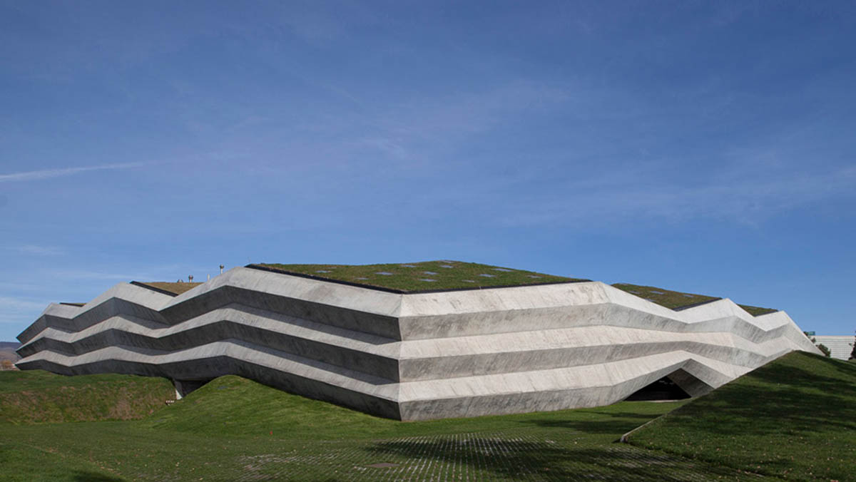 Folded concrete shell wraps coffee production plant by Giorgi Khmaladze Architects in Tbilisi
