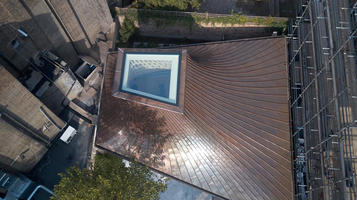 Gianni Botsford Architects transforms dilapidated bungalow with a giant copper clad roof in London