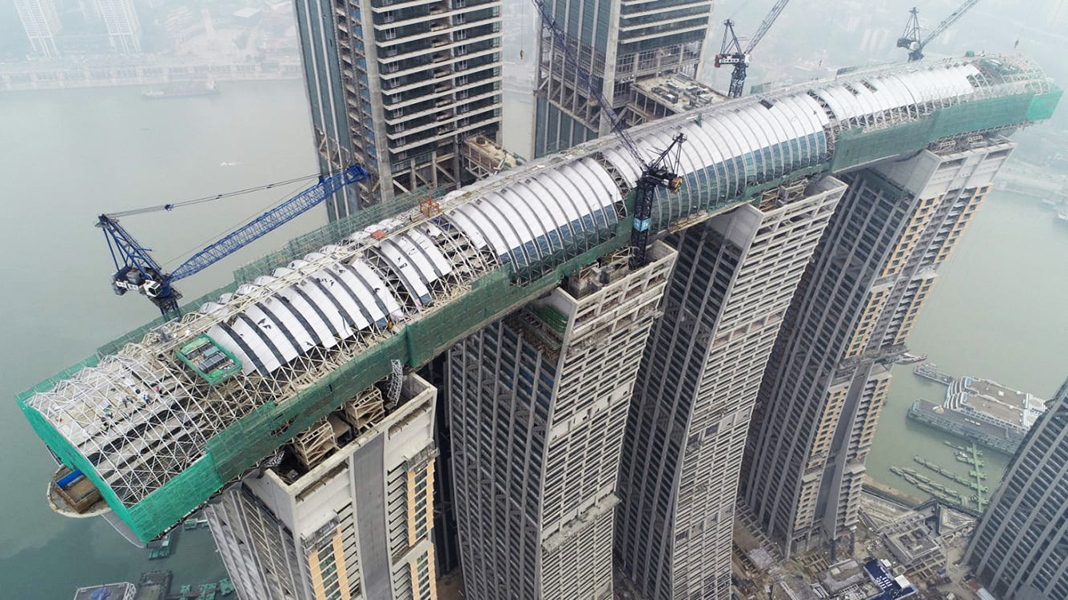 Safdie Architects' main structure of a giant sky bridge linking Raffles City Towers appears in China