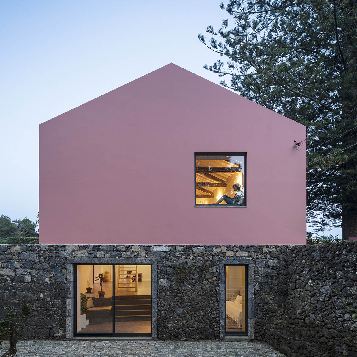 Mezzo Atelier transforms old barn into guesthouses featuring different hues of pink