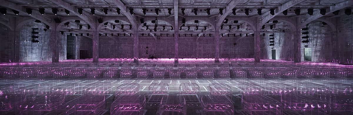 AMO filled Prada's fashion show stage with purple-lit inflatable stools
