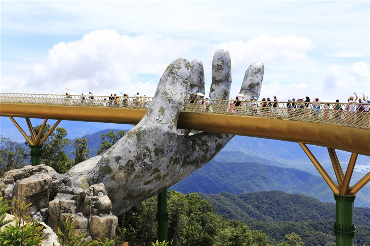 A Giant Pair Of Hands Lifts This Vietnamese Bridge Into The Sky