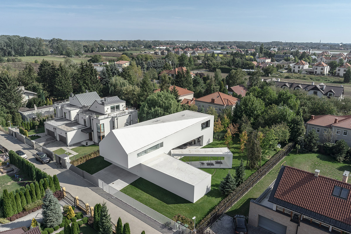 Movements of sun define the form of this protruding house designed by KWK Promes in Poland