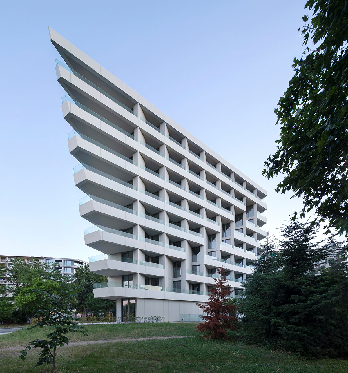 Sharp triangular balconies define this residential block designed by STARH in Bulgaria