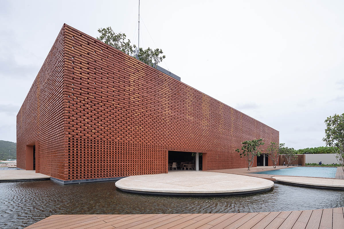 Wyndham Clubhouse by MIA Design Studio is built from bare brick layers to look like a lantern 
