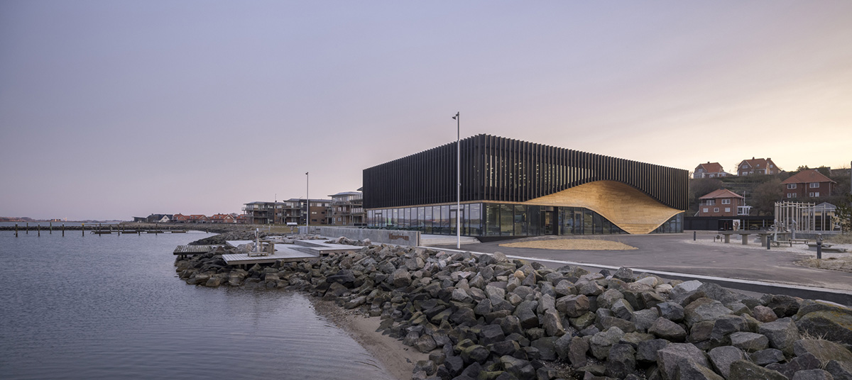 3XN Architects and SLA Architects complete Klimatorium featuring wooden wave in Denmark
