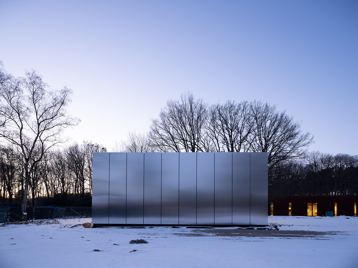 Inbo BV redesigns historic prisoner camp site with reflective pavilion and underground museum