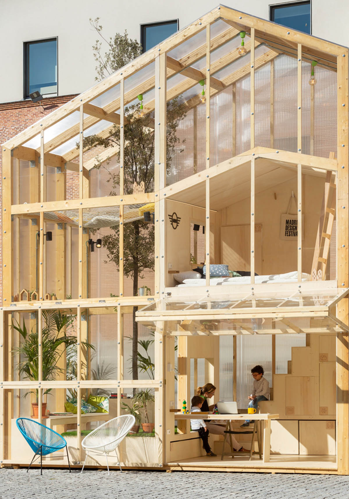 MYCC combines timber and polycarbonate for this multi-floor temporary pavilion in Madrid