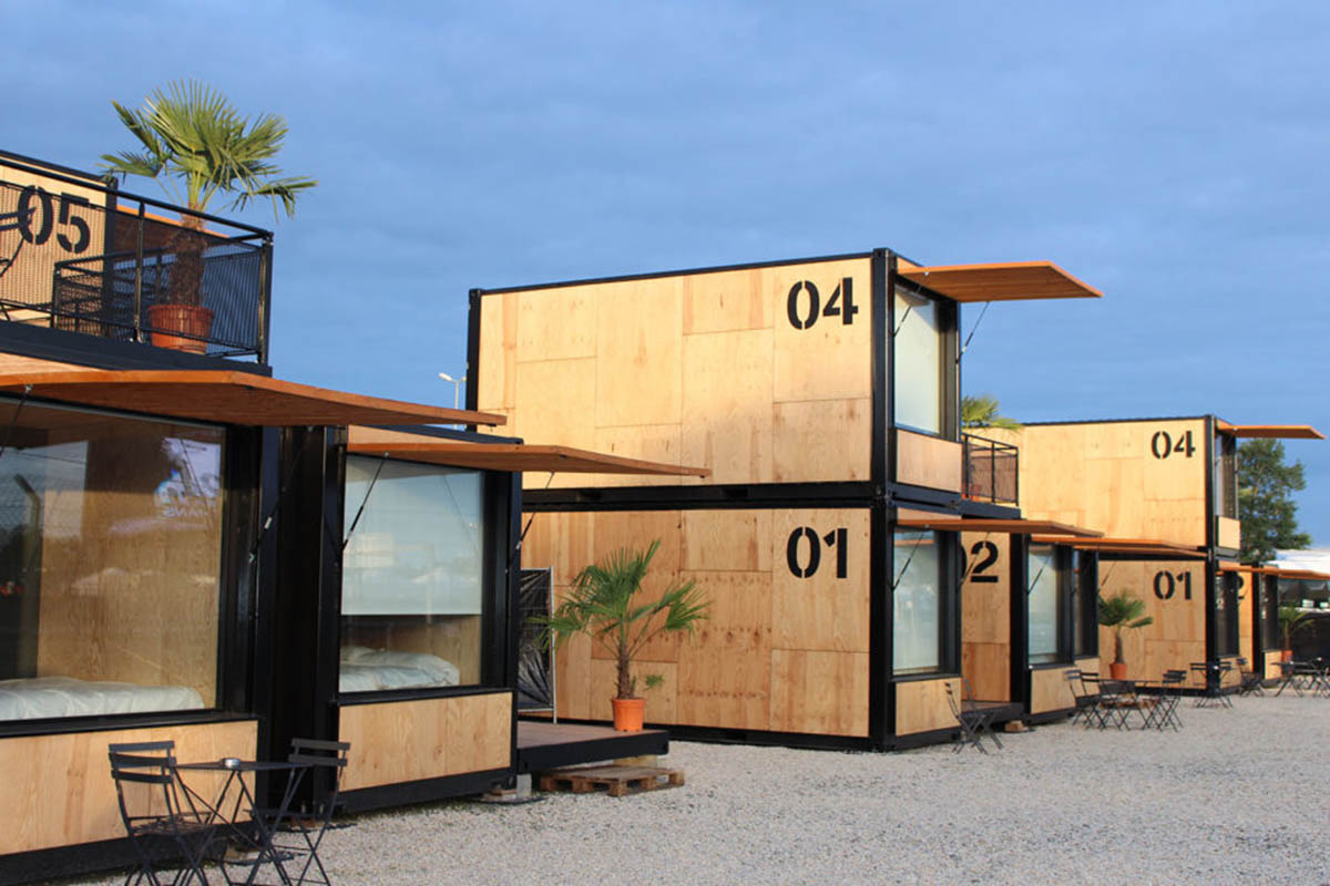 Real wooden shipping containers provide nomadic accommodation designed by Ora Ito