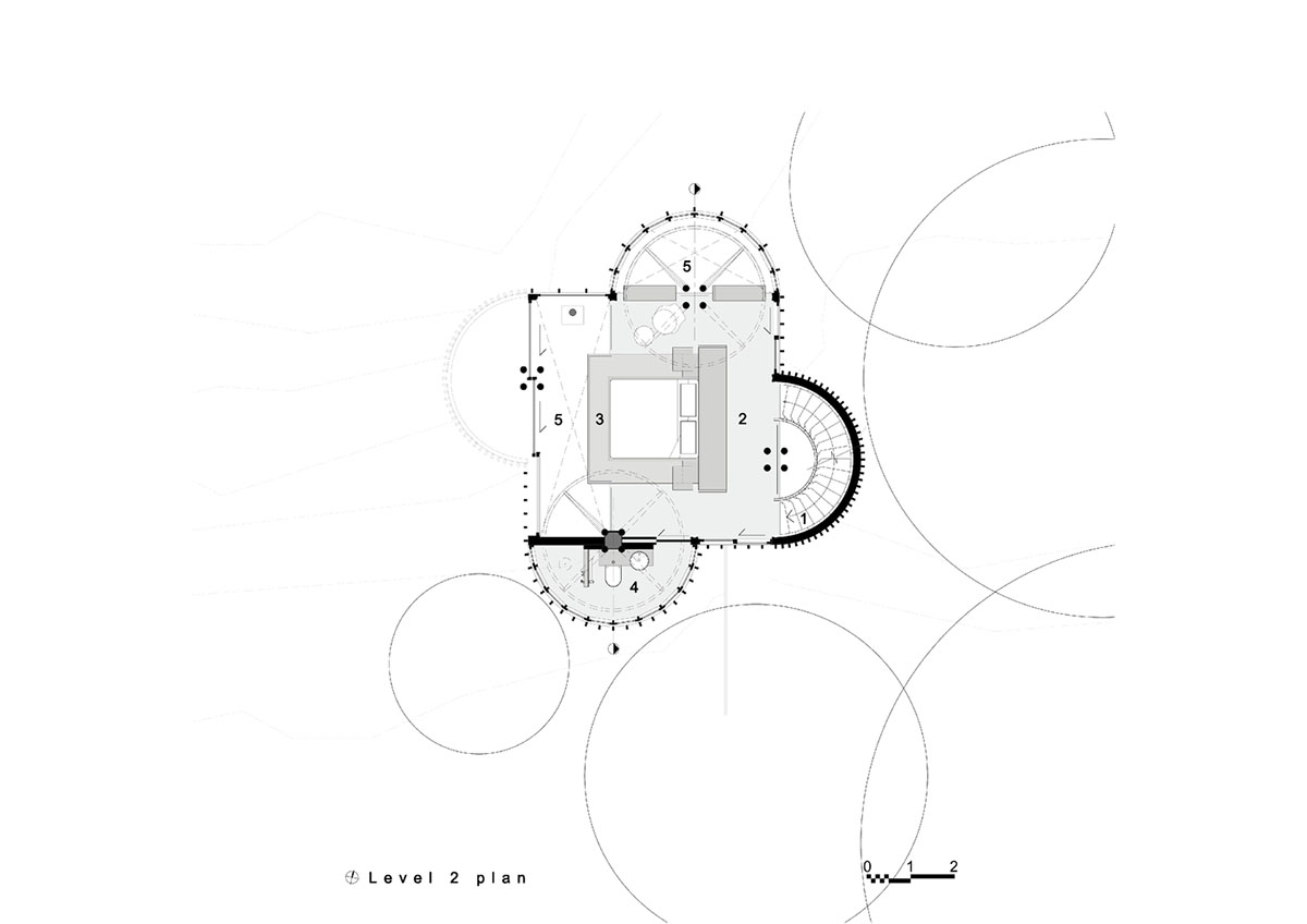 Circular tree house is raised over slender stilts to dominate the forest in every direction