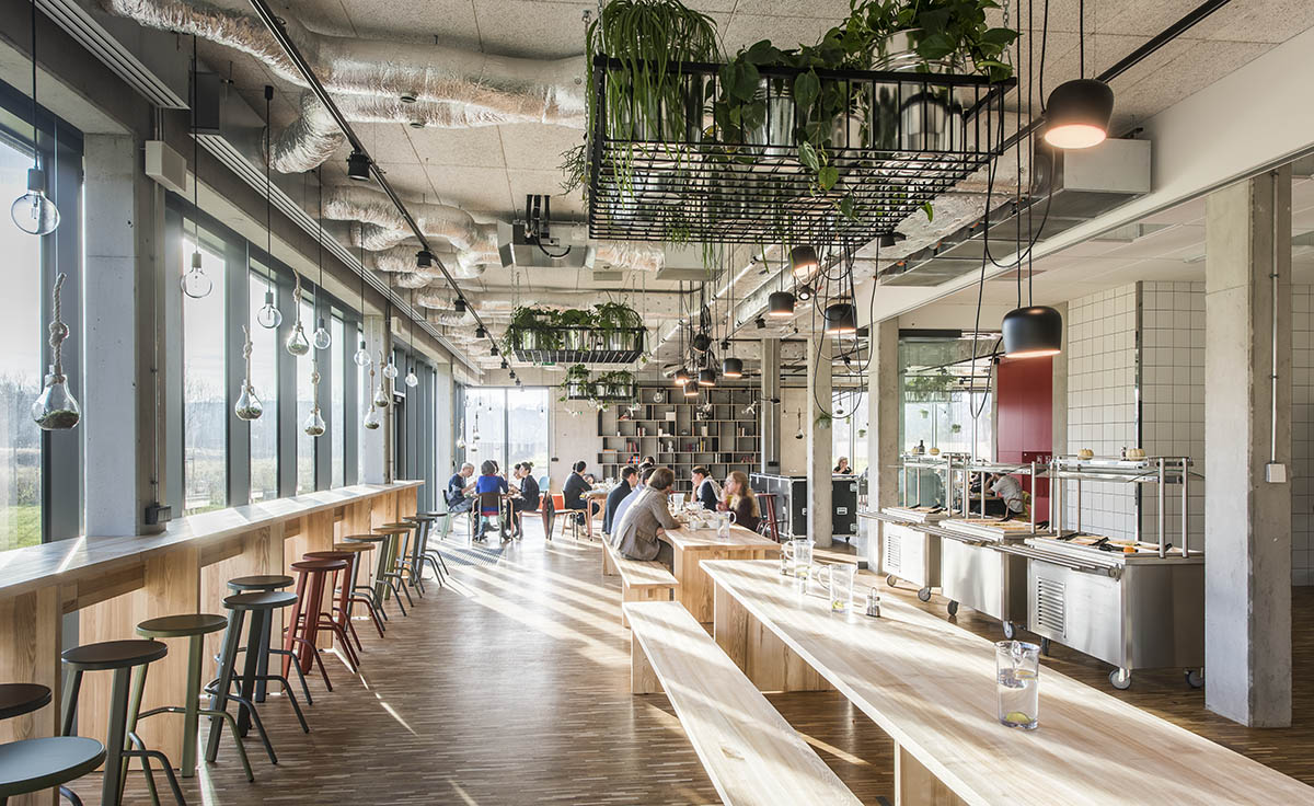 Huge tribunes invite students to sit and experience the courtyard in Warsaw's Akademeia High School