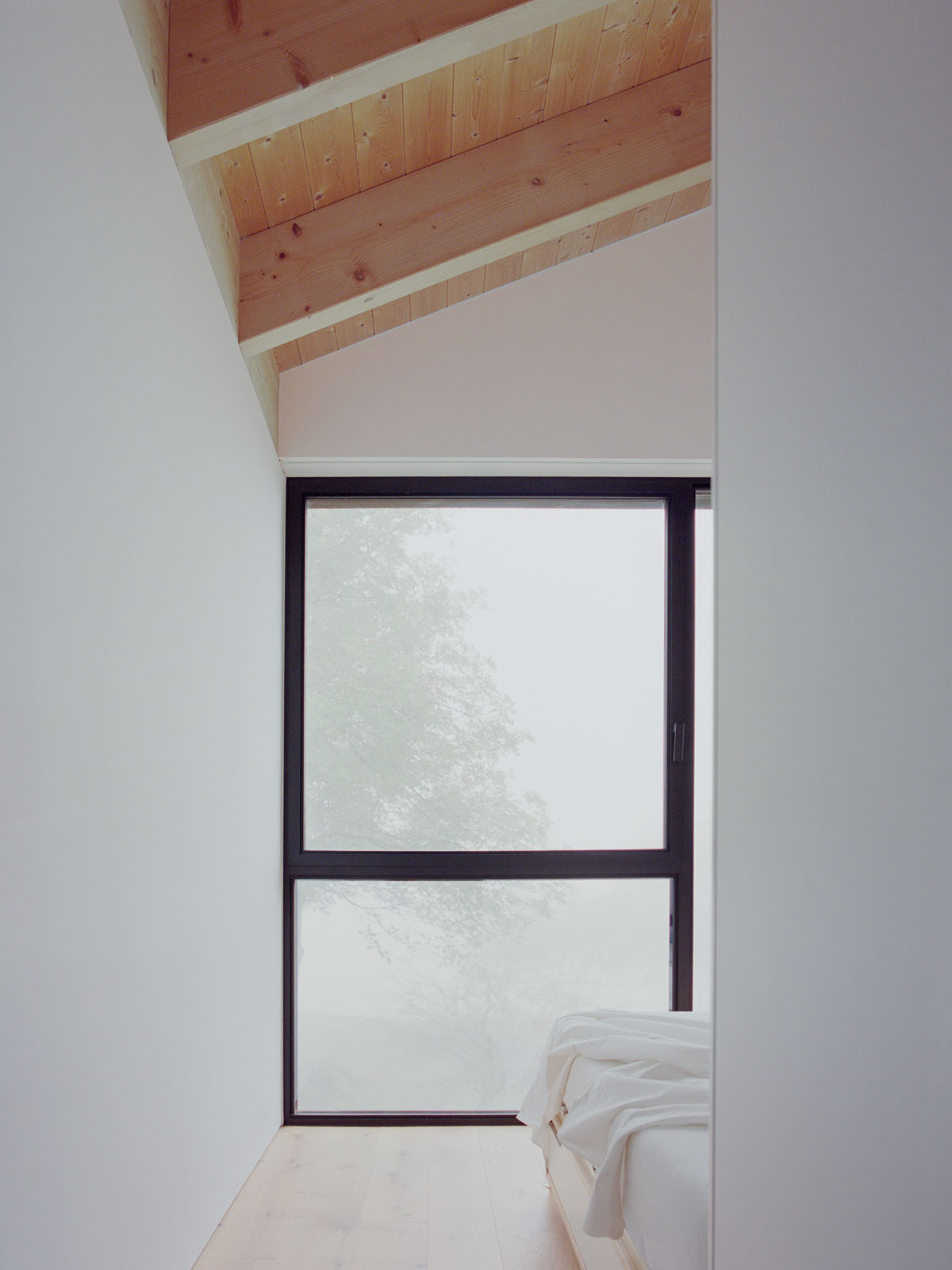 LADO architetti transforms 1970s house into a clean, monochromatic volume in Italy