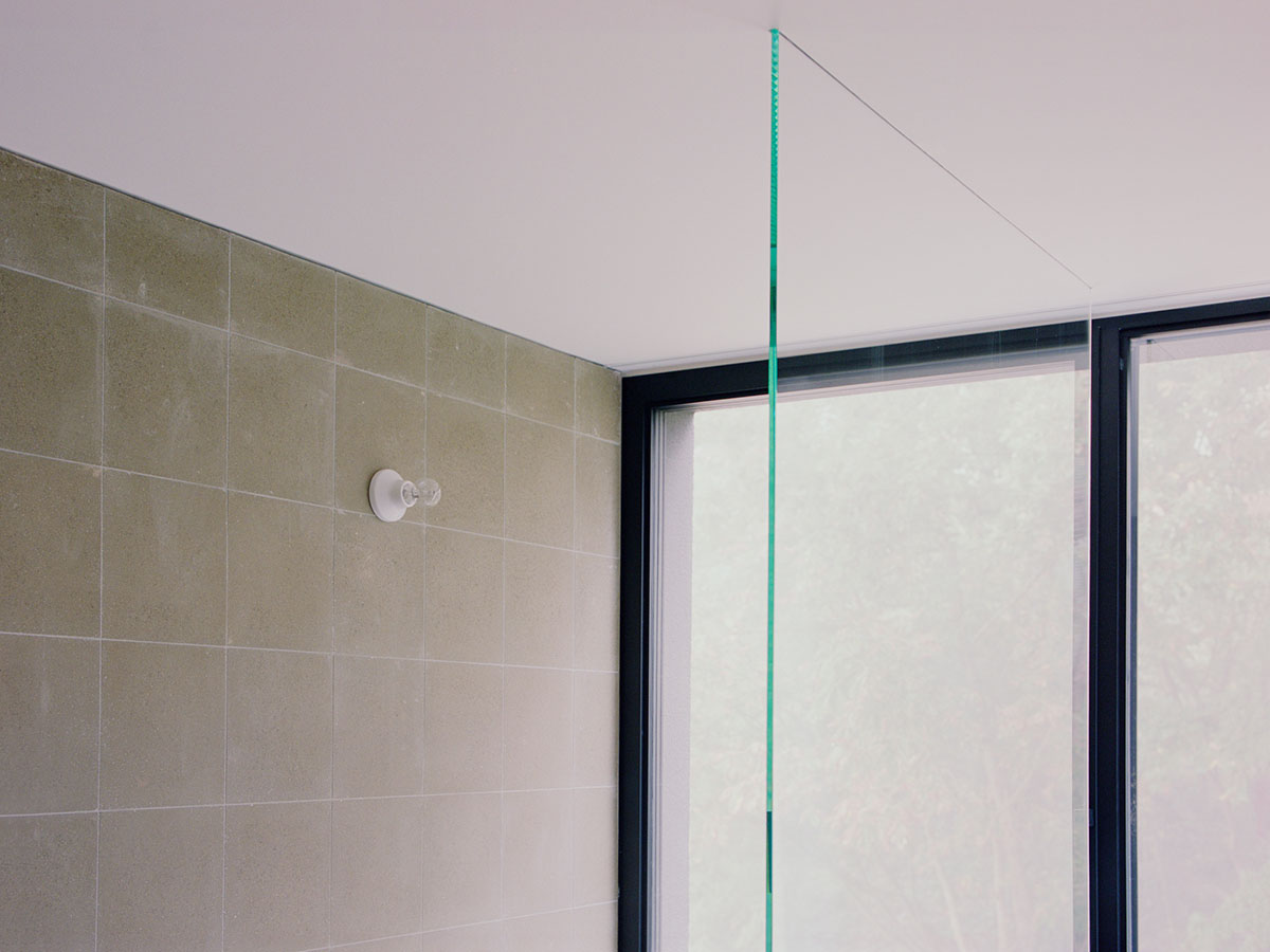 LADO architetti transforms 1970s house into a clean, monochromatic volume in Italy