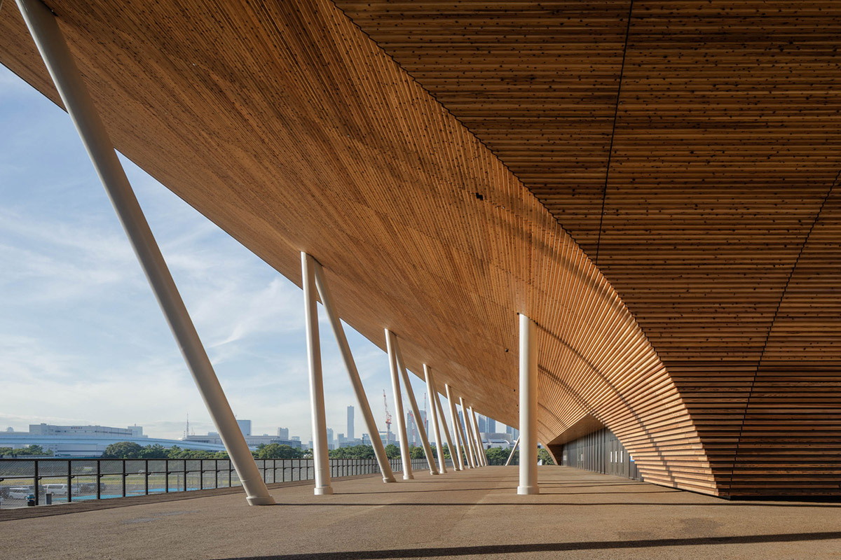 Nikken Sekkei and Shimizu Corporation-designed gymnastics centre features a floating wooden vessel