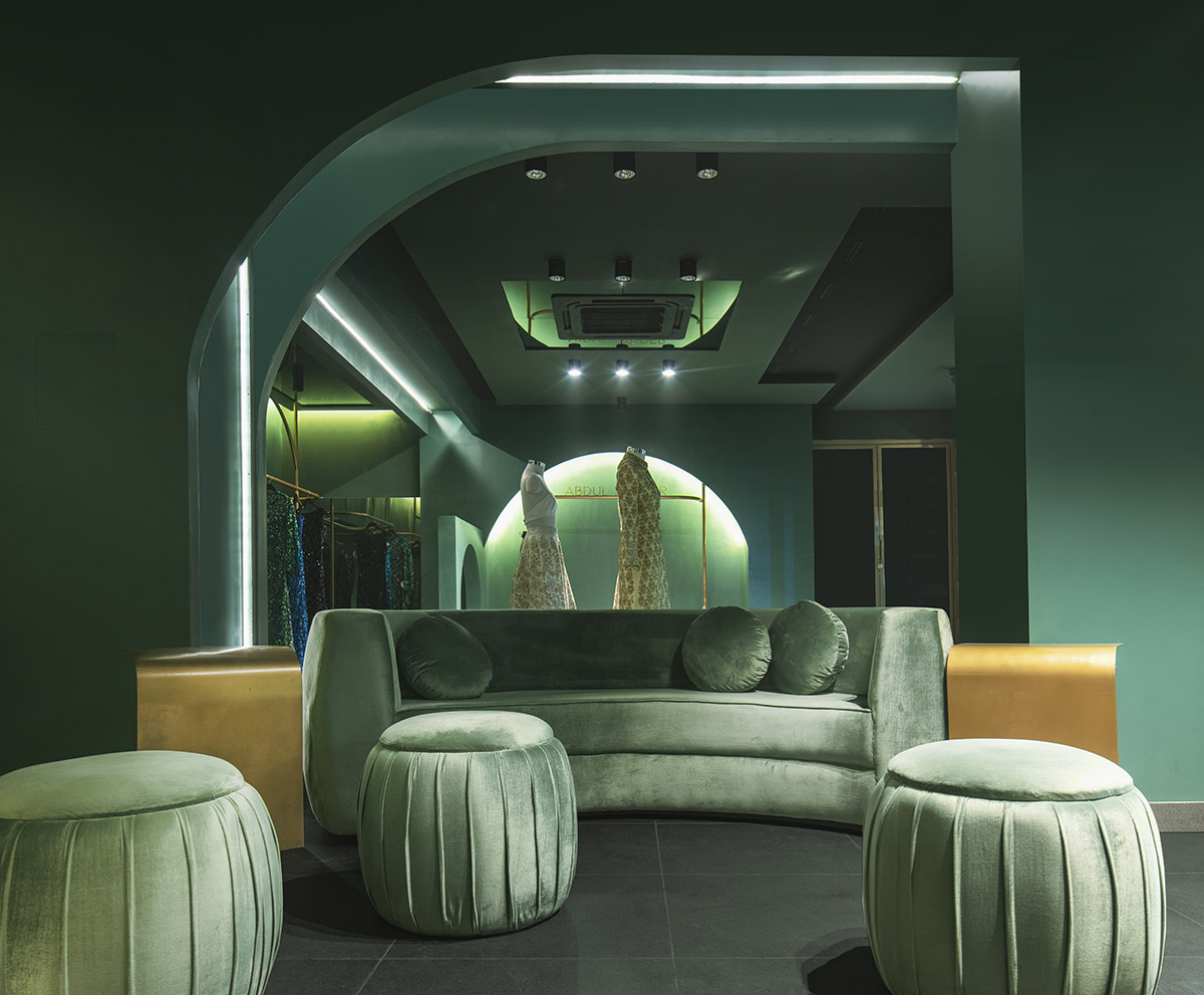 Pantone Collective Design Studio used dark colors of green in this flagship store in New Delhi
