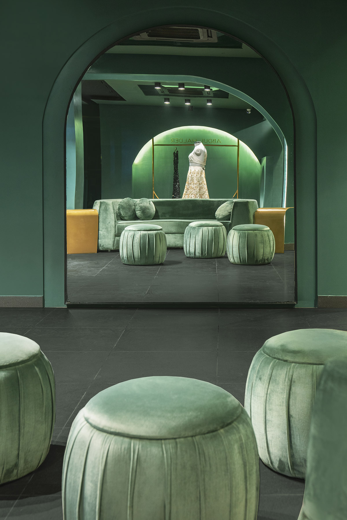 Pantone Collective Design Studio used dark colors of green in this flagship store in New Delhi