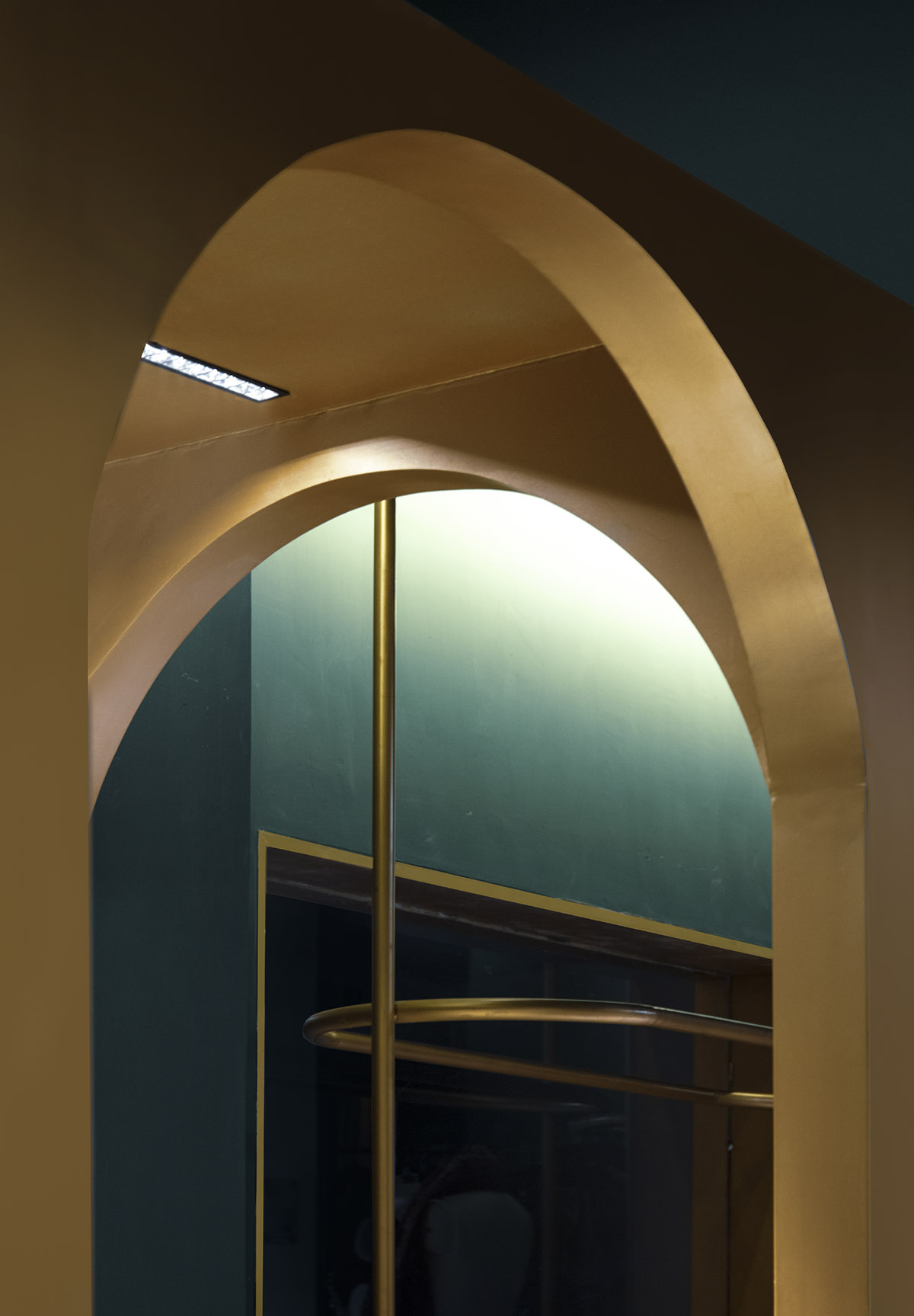 Pantone Collective Design Studio used dark colors of green in this flagship store in New Delhi