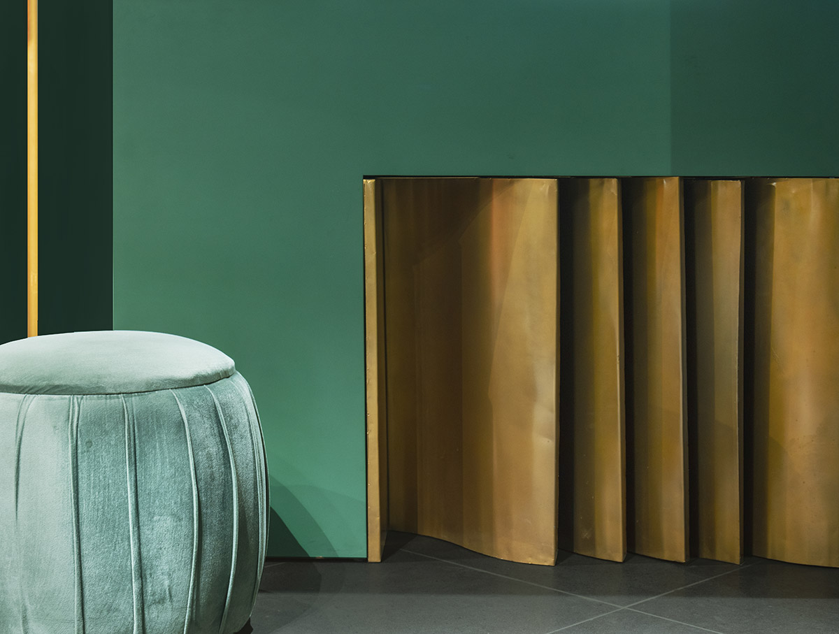 Pantone Collective Design Studio used dark colors of green in this flagship store in New Delhi