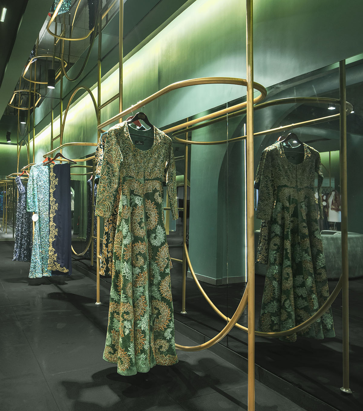 Pantone Collective Design Studio used dark colors of green in this flagship store in New Delhi