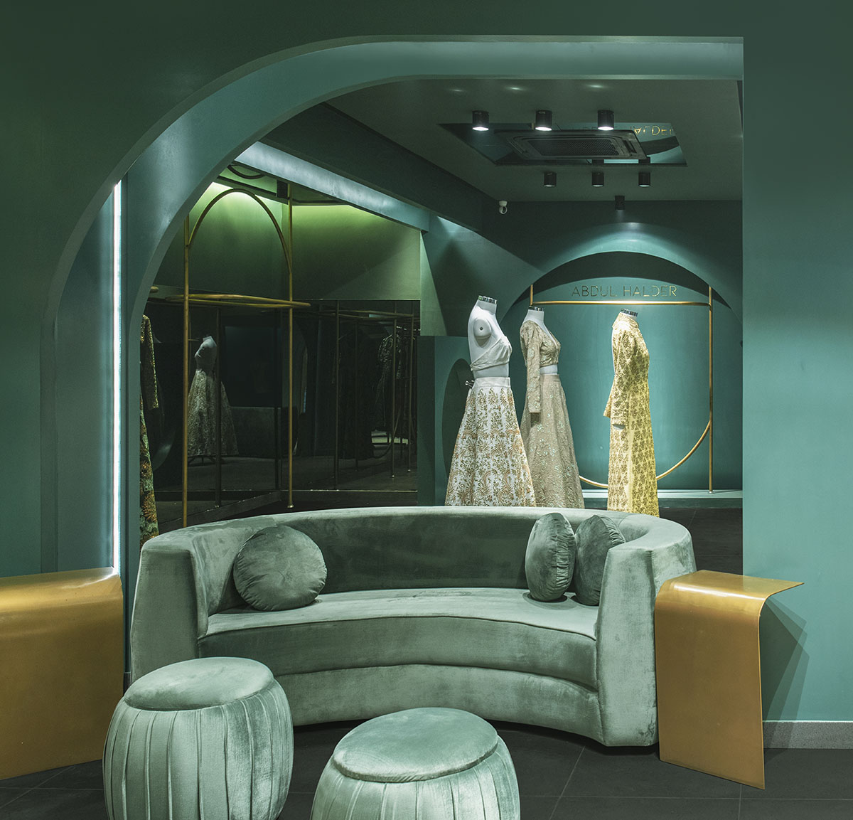 Pantone Collective Design Studio used dark colors of green in this flagship store in New Delhi