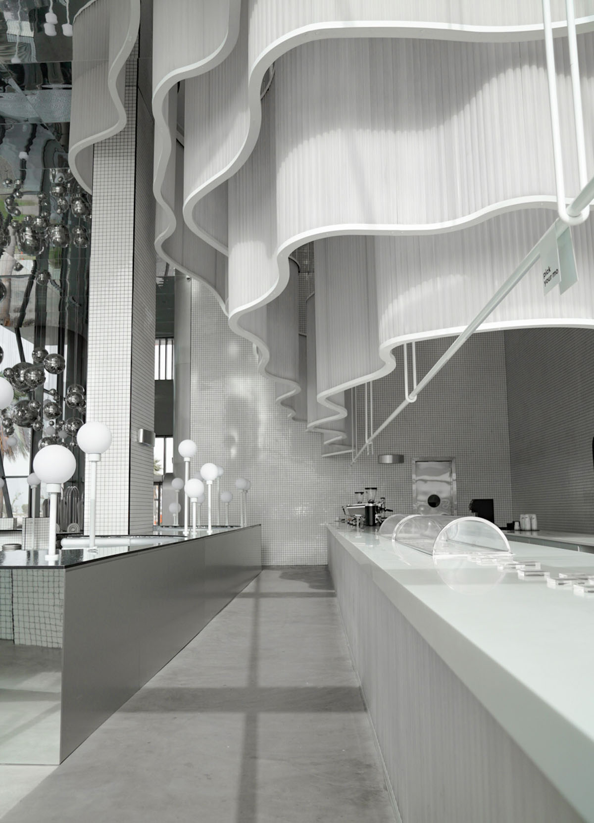 Masquespacio creates metallic interiors and water-inspired spaces for bakery in Saudi Arabia 