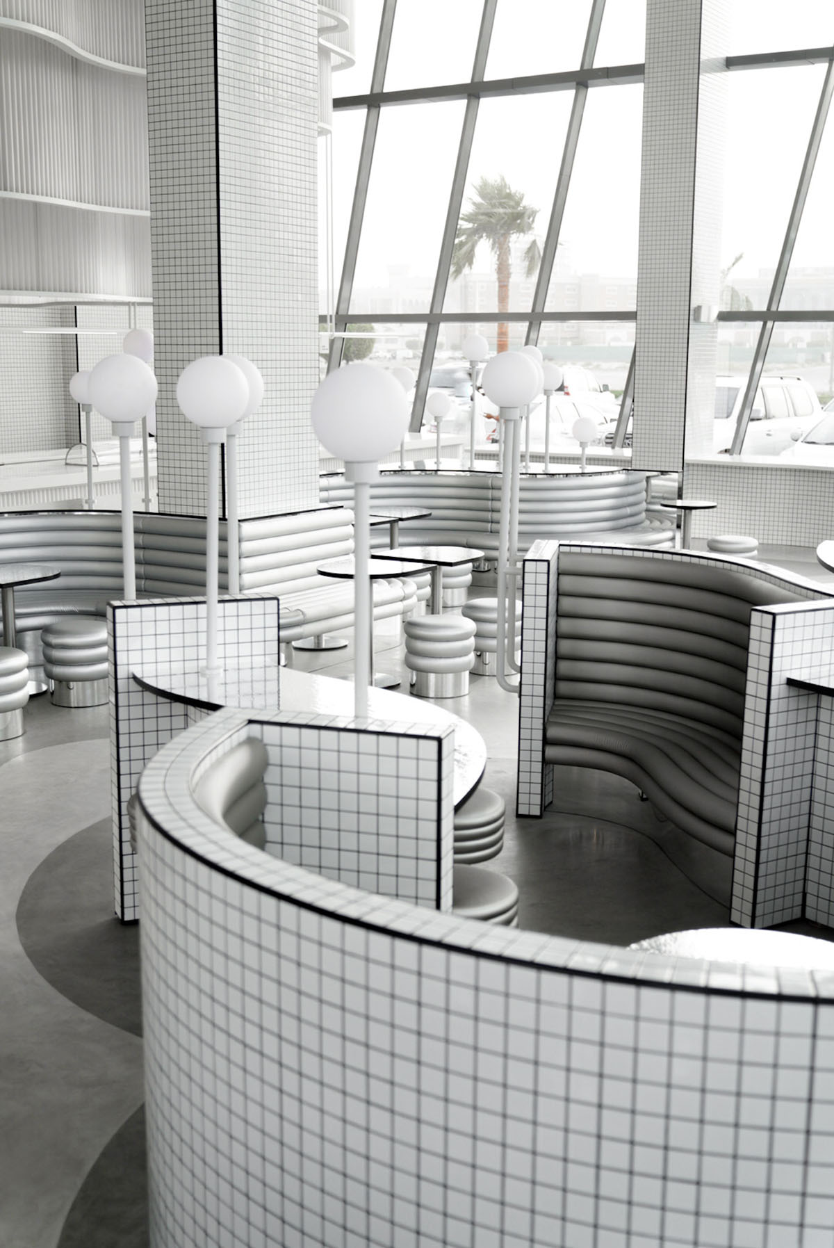 Masquespacio creates metallic interiors and water-inspired spaces for bakery in Saudi Arabia 